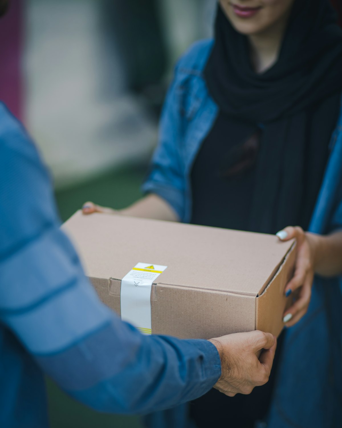 Abandoned Cart Recovery voice AI for e-commerce — A customer receiving a delivered parcel