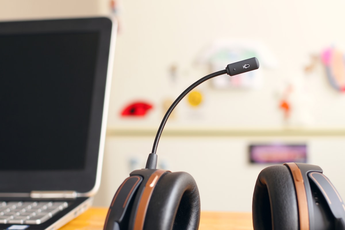 Outbound Sales & Lead Qualification voice AI for microfinance & lending — A headset and laptop set up for outbound sales calls